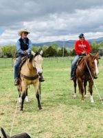 Cole Snider and Brooke Hirschy telling stories at branding, hirschy ranch, harrington hirschy horses, jack hirschy livestock